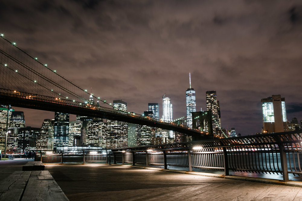  Lower Manhattan Skyline behind the Brooklyn Bridge at night, NYC 